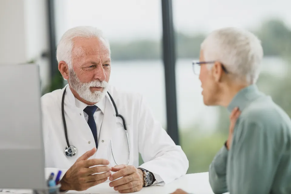 A doctor talking with a patient during an appointment